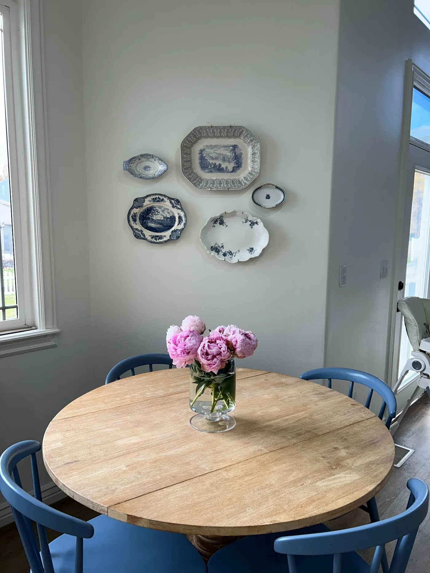 Decorative plate collection arranged on a dining room wall